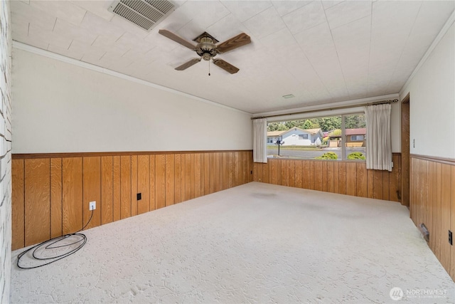 2815 NE Wyoming St, Bremerton, WA 98310 - carpeted spare room featuring a wainscoted wall, wood walls, and ceiling fan