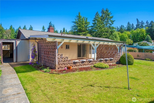 2815 NE Wyoming St, Bremerton, WA 98310 - rear view of house featuring a chimney, a lawn, and a porch