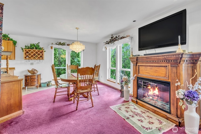 303 N B St, Roslyn, WA 98941 - carpeted dining space with a fireplace with flush hearth and a chandelier