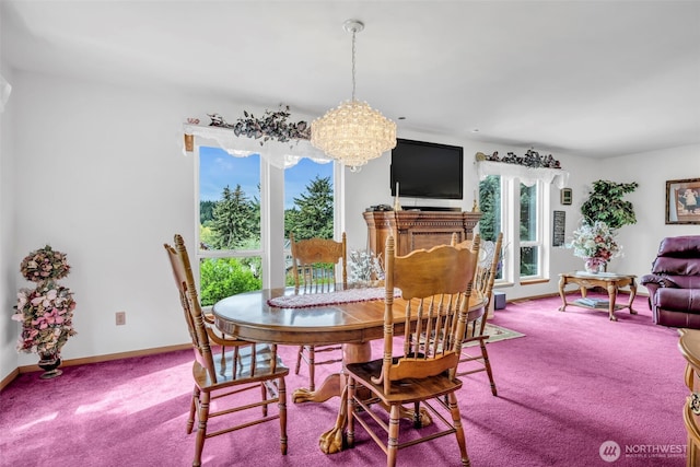 303 N B St, Roslyn, WA 98941 - carpeted dining room with healthy amount of natural light, a chandelier, and baseboards