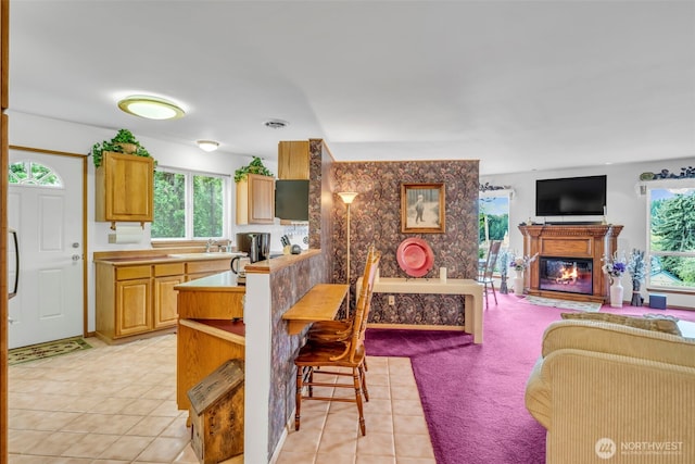 303 N B St, Roslyn, WA 98941 - kitchen with a glass covered fireplace, open floor plan, healthy amount of natural light, and light countertops