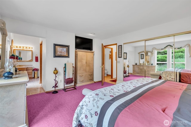 303 N B St, Roslyn, WA 98941 - bedroom featuring light carpet, a closet, and baseboards