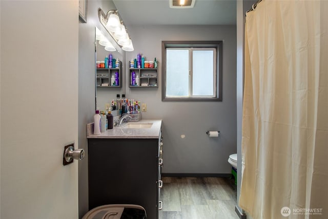 1918 E Alder St, Walla Walla, WA 99362 - full bath with vanity, wood finished floors, and a shower with curtain