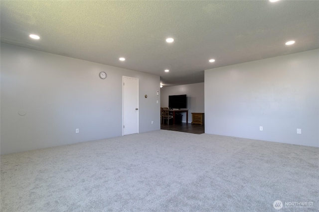 1918 E Alder St, Walla Walla, WA 99362 - unfurnished living room featuring carpet, recessed lighting, and a textured ceiling