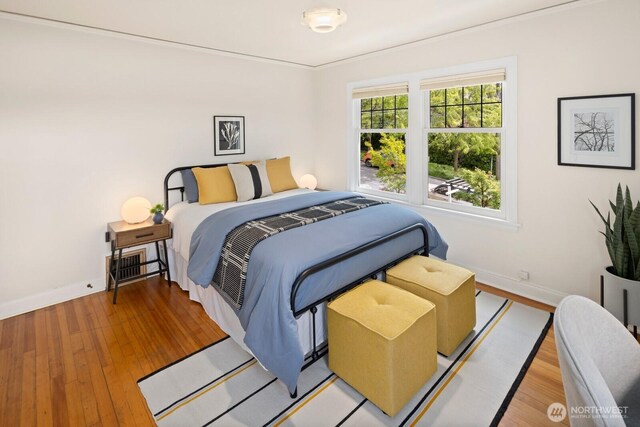 116 E Edgar St, Seattle, WA 98102 - bedroom featuring baseboards and wood finished floors