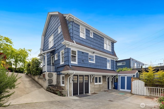 116 E Edgar St, Seattle, WA 98102 - back of house featuring roof with shingles and a gambrel roof