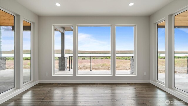 6988 Stonecrest Rd NE, Moses Lake, WA 98837 - unfurnished sunroom featuring healthy amount of natural light, recessed lighting, and hardwood / wood-style flooring