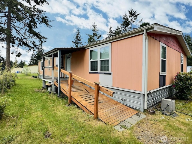 8304 192nd Street Ct E Unit 24, Spanaway, WA 98387 - view of home's exterior featuring a yard