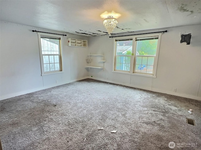 8304 192nd Street Ct E Unit 24, Spanaway, WA 98387 - carpeted spare room with a chandelier and plenty of natural light