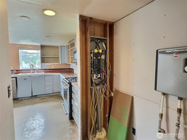 8304 192nd Street Ct E Unit 24, Spanaway, WA 98387 - kitchen with stainless steel appliances, a sink, concrete floors, and open shelves