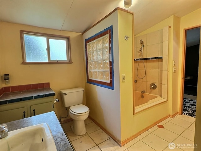 8304 192nd Street Ct E Unit 24, Spanaway, WA 98387 - bathroom featuring tile patterned flooring, toilet, a sink, and shower / tub combination