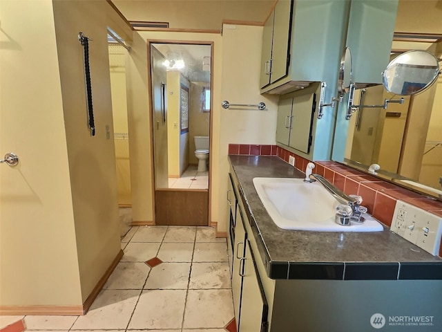 8304 192nd Street Ct E Unit 24, Spanaway, WA 98387 - bathroom with toilet, tile patterned flooring, and vanity