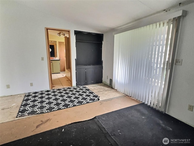 8304 192nd Street Ct E Unit 24, Spanaway, WA 98387 - bedroom with vaulted ceiling and ensuite bathroom