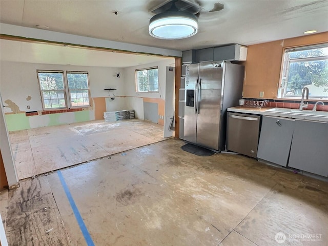 8304 192nd Street Ct E Unit 24, Spanaway, WA 98387 - kitchen with stainless steel appliances, a sink, and gray cabinetry