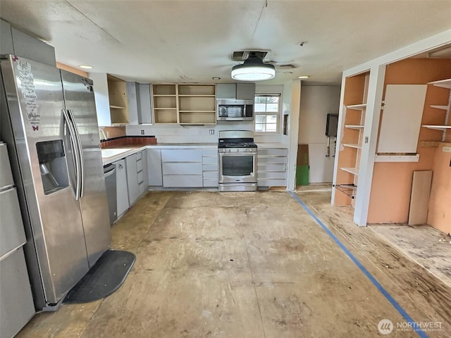 8304 192nd Street Ct E Unit 24, Spanaway, WA 98387 - kitchen with stainless steel appliances, open shelves, and gray cabinets