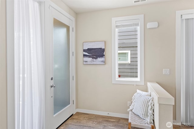 938 SW 97th St, Seattle, WA 98106 - doorway to outside with wood finished floors and baseboards