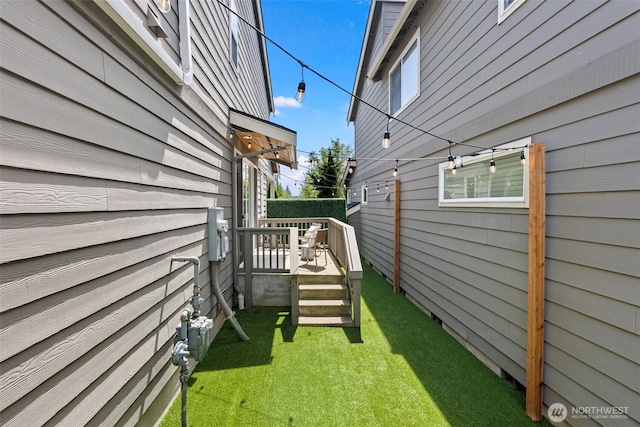 938 SW 97th St, Seattle, WA 98106 - view of green lawn with a wooden deck