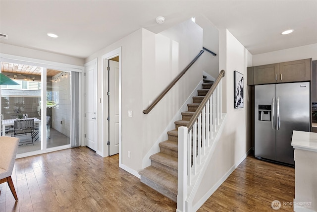 938 SW 97th St, Seattle, WA 98106 - stairs featuring wood finished floors, recessed lighting, and baseboards