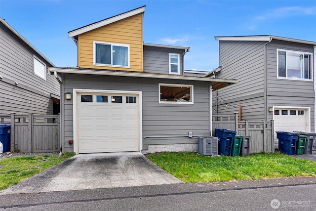 938 SW 97th St, Seattle, WA 98106 - view of front of property with central AC unit, a garage, and asphalt driveway