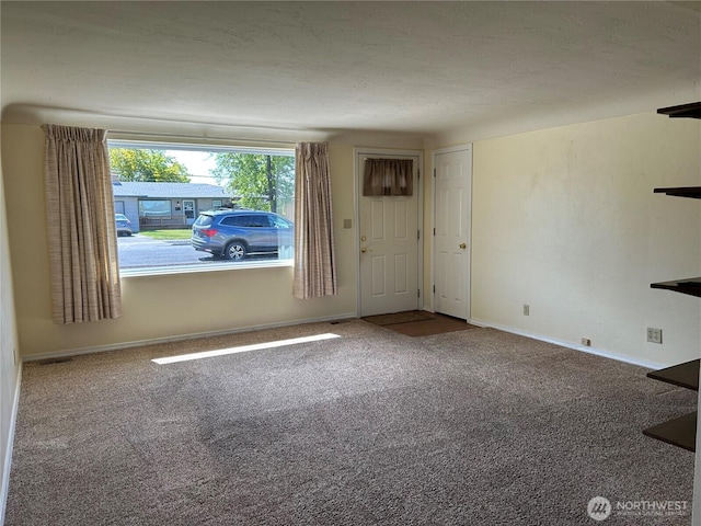 822 S Evergreen Dr, Moses Lake, WA 98837 - unfurnished living room featuring carpet floors and baseboards