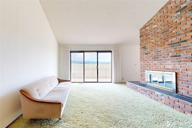 1220 Valley Vista Ave, Walla Walla, WA 99362 - living area with a fireplace, carpet floors, and a textured ceiling