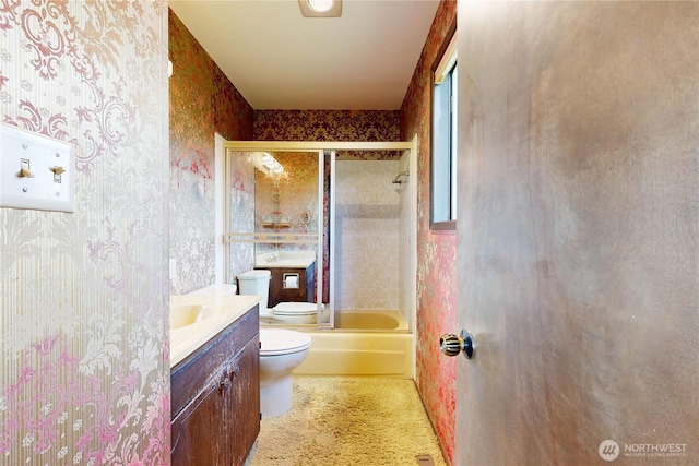 1220 Valley Vista Ave, Walla Walla, WA 99362 - bathroom with wallpapered walls, toilet, vanity, and combined bath / shower with glass door