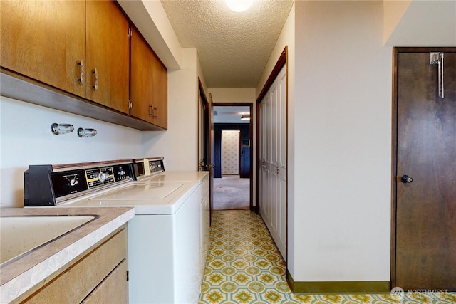 1220 Valley Vista Ave, Walla Walla, WA 99362 - laundry area featuring cabinet space, separate washer and dryer, and a textured ceiling