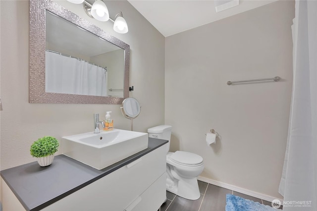 20620 76th Ave W Unit A, Edmonds, WA 98026 - bathroom featuring vanity, toilet, and baseboards