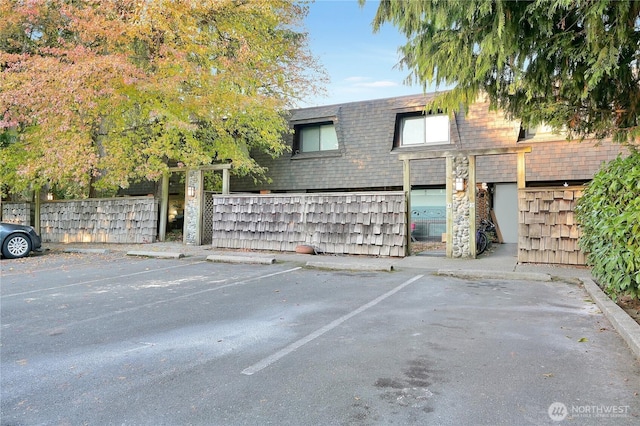 20620 76th Ave W Unit A, Edmonds, WA 98026 - view of front of home with mansard roof, uncovered parking, and roof with shingles