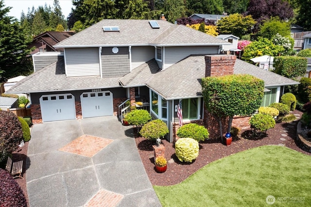 16605 71st Pl W, Lynnwood, WA 98037 - view of front of house featuring a shingled roof, brick siding, driveway, and a chimney