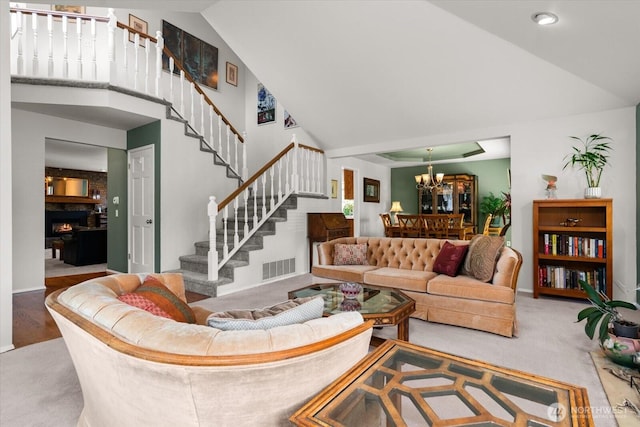 16605 71st Pl W, Lynnwood, WA 98037 - living room with high vaulted ceiling, stairs, a chandelier, carpet flooring, and baseboards