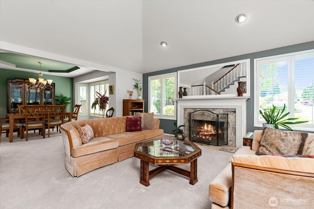 16605 71st Pl W, Lynnwood, WA 98037 - carpeted living room with a chandelier, a premium fireplace, lofted ceiling, and recessed lighting
