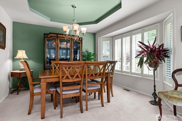 16605 71st Pl W, Lynnwood, WA 98037 - dining area featuring a chandelier, baseboards, and light carpet