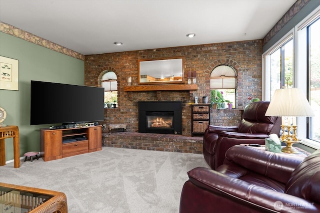 16605 71st Pl W, Lynnwood, WA 98037 - carpeted living room featuring plenty of natural light, a fireplace, and brick wall