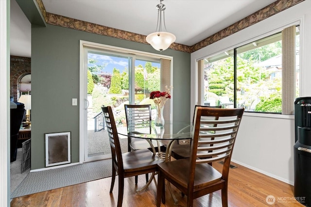 16605 71st Pl W, Lynnwood, WA 98037 - dining area with healthy amount of natural light, baseboards, and light wood-style floors