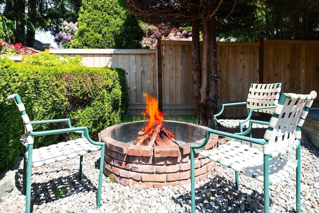 16605 71st Pl W, Lynnwood, WA 98037 - view of patio with an outdoor fire pit