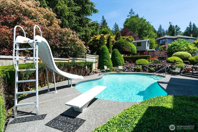 16605 71st Pl W, Lynnwood, WA 98037 - view of pool featuring a water slide, a diving board, and a patio area