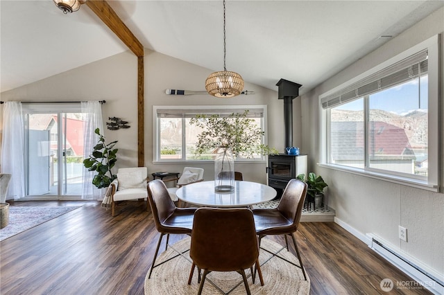 421 Lakeview Dr, Orondo, WA 98843 - dining space featuring baseboard heating, a chandelier, a wood stove, dark wood-style flooring, and baseboards