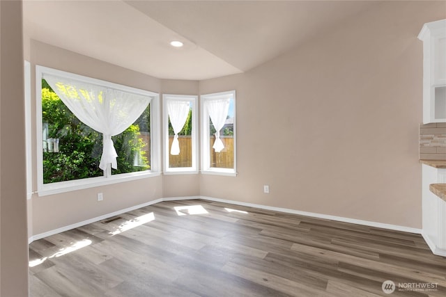 15127 148th Avenue Ct E, Orting, WA 98360 - empty room featuring wood finished floors, baseboards, and recessed lighting