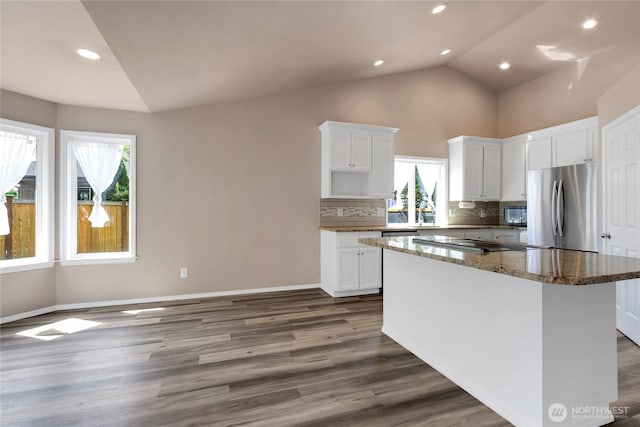 15127 148th Avenue Ct E, Orting, WA 98360 - kitchen featuring freestanding refrigerator, plenty of natural light, dark wood-type flooring, backsplash, and recessed lighting