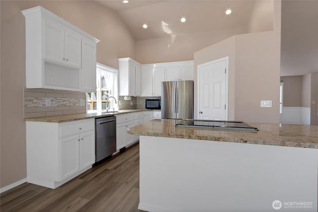 15127 148th Avenue Ct E, Orting, WA 98360 - kitchen with black appliances, a sink, wood finished floors, white cabinets, and tasteful backsplash