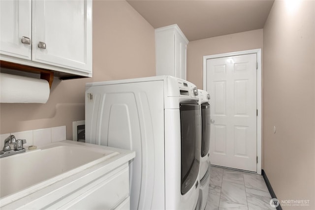 15127 148th Avenue Ct E, Orting, WA 98360 - laundry area with separate washer and dryer, cabinet space, light marble finish floors, and baseboards
