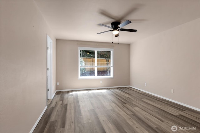 15127 148th Avenue Ct E, Orting, WA 98360 - spare room featuring a ceiling fan, wood finished floors, and baseboards