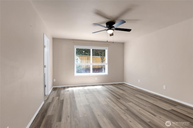15127 148th Avenue Ct E, Orting, WA 98360 - empty room with wood finished floors, ceiling fan, and baseboards