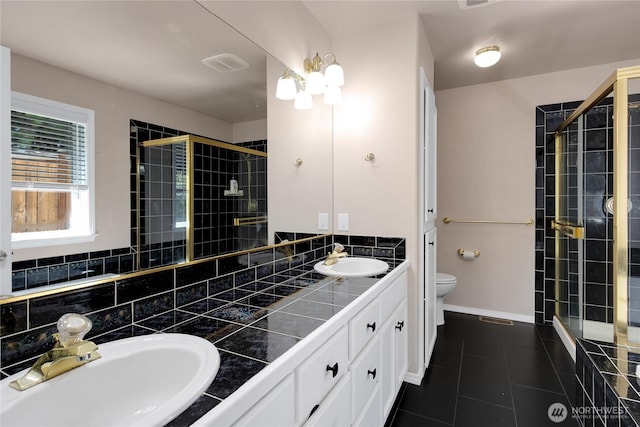 15127 148th Avenue Ct E, Orting, WA 98360 - full bathroom with toilet, a stall shower, double vanity, and tile patterned floors