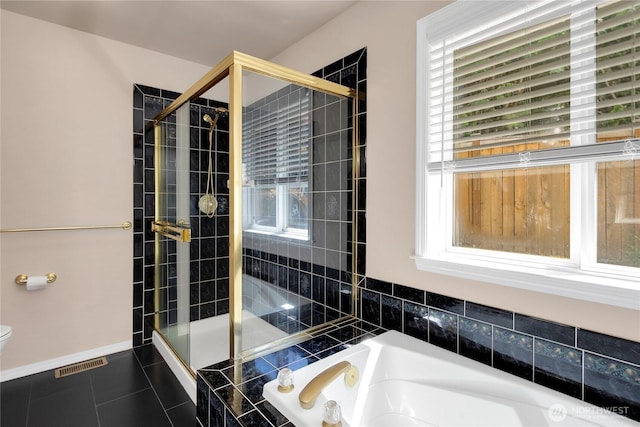 15127 148th Avenue Ct E, Orting, WA 98360 - bathroom featuring a bath, tiled shower, toilet, and tile patterned floors