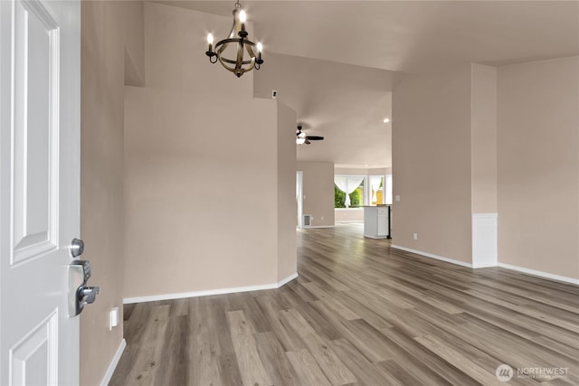 15127 148th Avenue Ct E, Orting, WA 98360 - foyer with wood finished floors, a chandelier, and baseboards