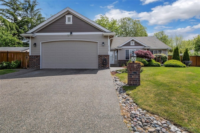 15127 148th Avenue Ct E, Orting, WA 98360 - view of front facade with brick siding, driveway, and a garage