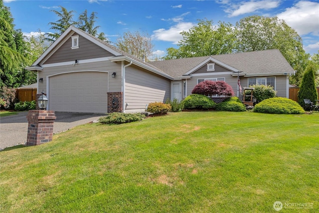 15127 148th Avenue Ct E, Orting, WA 98360 - ranch-style home featuring asphalt driveway, a garage, a front yard, and brick siding