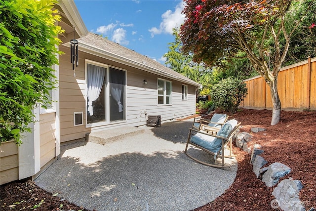 15127 148th Avenue Ct E, Orting, WA 98360 - back of house featuring a patio and roof with shingles